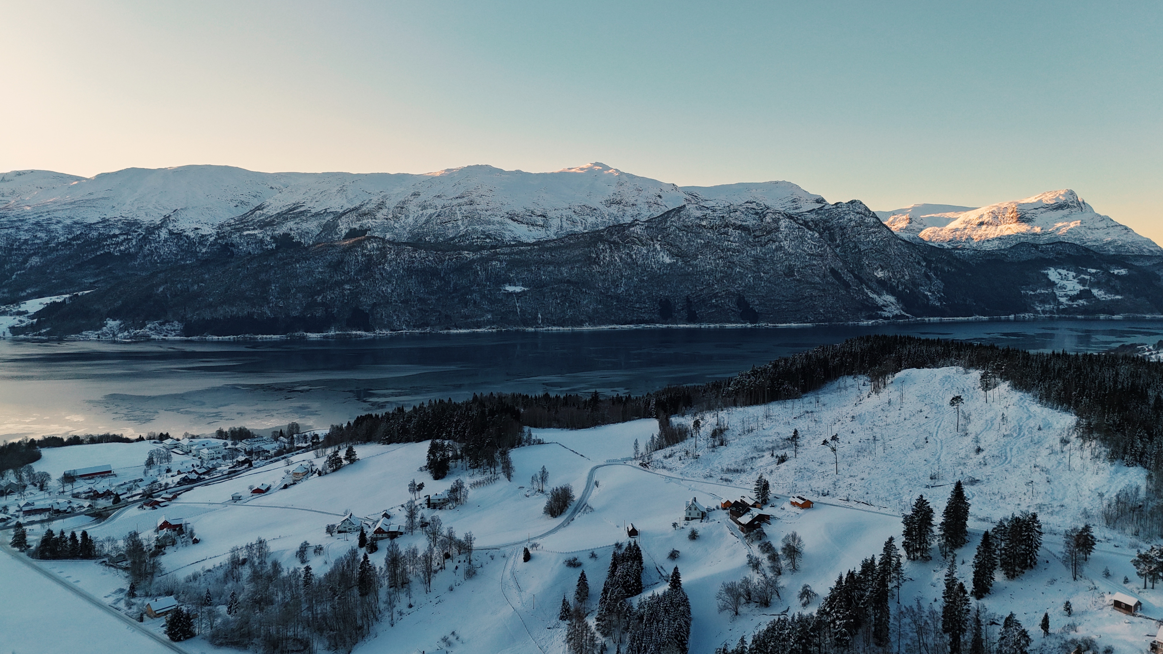 Wide fjord panorama with forested slopes